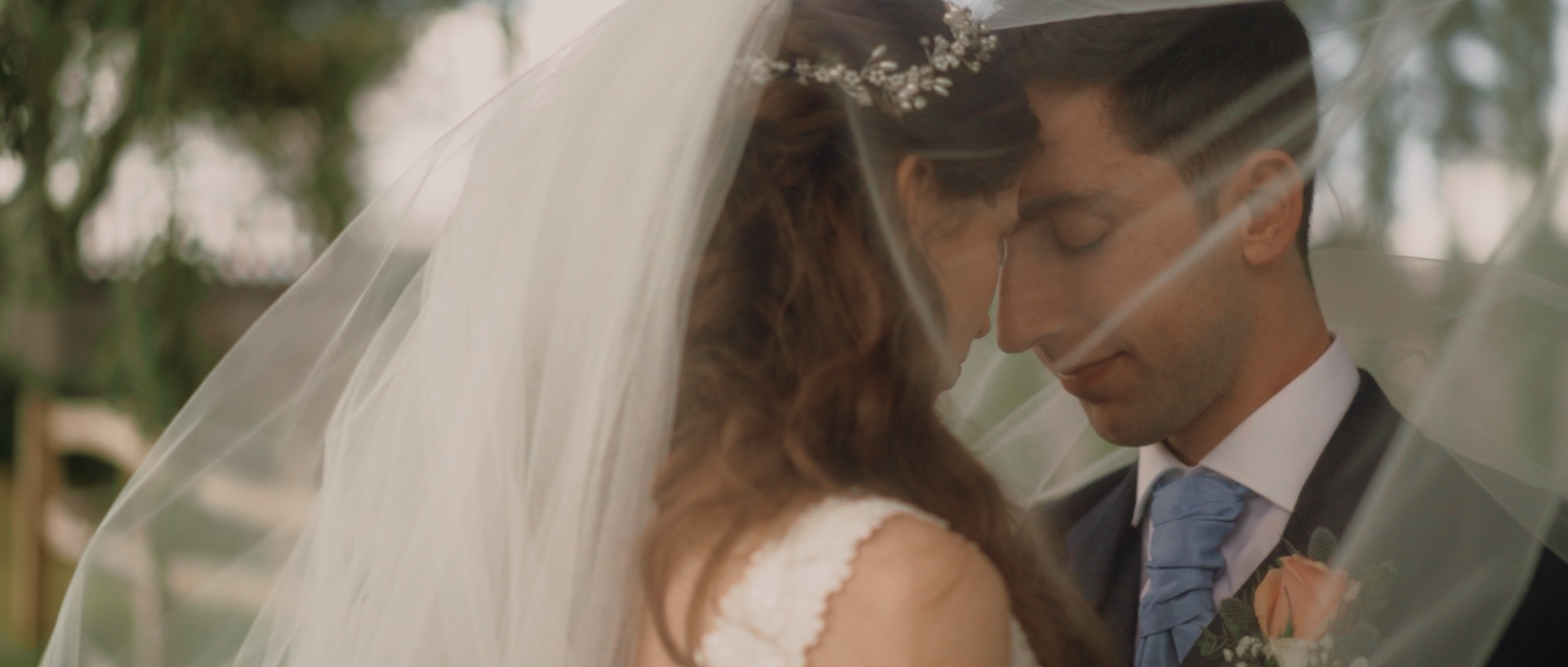 ALexandra and Joe under a Veil