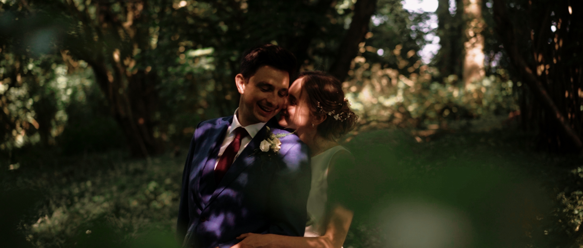 A and R kiss in the woods